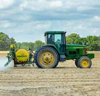 Green and Yellow Tractor on Dirt